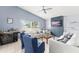 Comfortable living room with ceiling fan, mounted tv and modern decor at 2511 Brookstone Dr, Kissimmee, FL 34744