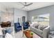 Spacious living room with ceiling fan, tile floors and bright lighting at 2511 Brookstone Dr, Kissimmee, FL 34744