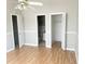 Bedroom featuring multiple closets and an attached bathroom for added comfort and privacy at 2524 Woodgate Blvd # 201, Orlando, FL 32822