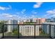 Balcony view showing the city skyline with bright blue skies and puffy white clouds at 260 S Osceola Ave # 1207, Orlando, FL 32801