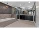 Modern bathroom features a large vanity, soaking tub, and glass enclosed shower at 260 S Osceola Ave # 1207, Orlando, FL 32801