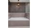 The neutral colored bathtub creates a relaxing at-home spa experience at 260 S Osceola Ave # 1207, Orlando, FL 32801