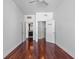 Bedroom featuring wood floors, a ceiling fan, and bathroom access at 260 S Osceola Ave # 1207, Orlando, FL 32801