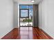 Bedroom with hardwood floors, a large window, and an expansive city view at 260 S Osceola Ave # 1207, Orlando, FL 32801