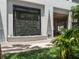 Modern building exterior with a decorative water feature and lush landscaping at 260 S Osceola Ave # 1207, Orlando, FL 32801