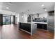 Open concept kitchen with sleek cabinetry, modern appliances, and an island counter at 260 S Osceola Ave # 1207, Orlando, FL 32801
