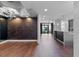 Spacious living room with hardwood floors open to the modern kitchen and city views at 260 S Osceola Ave # 1207, Orlando, FL 32801