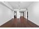 Spacious living room with hardwood floors and an open layout leading to the kitchen at 260 S Osceola Ave # 1207, Orlando, FL 32801