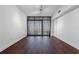 Living room featuring hardwood floors, ample natural light, and modern window treatments at 260 S Osceola Ave # 1207, Orlando, FL 32801