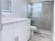 Updated bathroom featuring a modern vanity and glass-enclosed shower with marble-style tile at 2747 Rose Moss Ln, Orlando, FL 32807