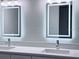 Bathroom featuring double sink vanity and LED mirrors at 2747 Rose Moss Ln, Orlando, FL 32807