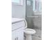 Bathroom featuring marble shower and modern toilet at 2747 Rose Moss Ln, Orlando, FL 32807