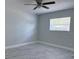 Bright bedroom with marble floors and modern ceiling fan at 2747 Rose Moss Ln, Orlando, FL 32807