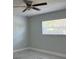 Bright bedroom with marble floors and modern ceiling fan at 2747 Rose Moss Ln, Orlando, FL 32807