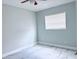 Neutral bedroom featuring marble floors, ceiling fan, and ample natural light at 2747 Rose Moss Ln, Orlando, FL 32807