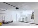 A well-lit garage featuring ample space, white walls, and laundry appliances at 2747 Rose Moss Ln, Orlando, FL 32807