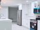 Bright kitchen with stainless steel appliances, white cabinets, and modern finishes at 2747 Rose Moss Ln, Orlando, FL 32807