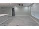 Open-concept living area featuring a light gray walls and marble-style tile flooring at 2747 Rose Moss Ln, Orlando, FL 32807