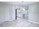 Spacious living area showcasing marble floors and view into the open kitchen at 2747 Rose Moss Ln, Orlando, FL 32807