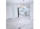 Inviting living space with marble floors and seamless flow to the open kitchen at 2747 Rose Moss Ln, Orlando, FL 32807