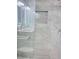 Marble shower featuring glass door and chrome fixtures at 2747 Rose Moss Ln, Orlando, FL 32807