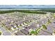 Expansive aerial view of a residential community near a lake and green space under a blue, cloudy sky at 2834 Common Crane Ct, St Cloud, FL 34773