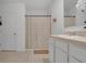 Bright bathroom featuring a shower/tub combo with neutral paint and a neutral-toned vanity at 2834 Common Crane Ct, St Cloud, FL 34773