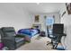 Modern themed bedroom with custom wall art, and comfortable seating at 2834 Common Crane Ct, St Cloud, FL 34773