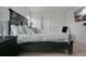 Bedroom featuring a large dark wood bed and modern decor creating a relaxing atmosphere at 2834 Common Crane Ct, St Cloud, FL 34773