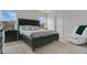 Bedroom with a plush, light gray carpet, modern furniture, and plenty of natural light at 2834 Common Crane Ct, St Cloud, FL 34773