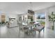 Bright dining area with modern decor that flows into the living room and access to the backyard at 2834 Common Crane Ct, St Cloud, FL 34773