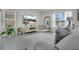 Open living area with chic decor, soft color palette and a view of the backyard at 2834 Common Crane Ct, St Cloud, FL 34773