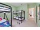 bedroom featuring multiple bunkbeds and green walls, creating a fun space at 2956 White Cedar Cir, Kissimmee, FL 34741