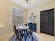 A cozy breakfast nook with lots of natural light and modern light fixture at 2956 White Cedar Cir, Kissimmee, FL 34741