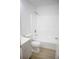 Bright bathroom featuring a shower and tub, toilet, vanity, and modern fixtures at 30101 Pga Dr, Sorrento, FL 32776