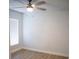 Bright bedroom with hardwood floors, neutral walls, and a large window at 30101 Pga Dr, Sorrento, FL 32776
