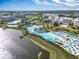 Stunning aerial view of the community resort showcasing pools, amenities, and lush landscaping at 3062 Pirate Way, Kissimmee, FL 34747