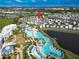 Aerial view showing location of property near resort-style amenities, pools, and waterfront at 3062 Pirate Way, Kissimmee, FL 34747