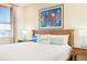 Bright bedroom with a cozy bed, beach-themed art, and warm, inviting decor at 3062 Pirate Way, Kissimmee, FL 34747