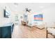 Open-concept living area featuring wood floors, a dining area, modern decor, and plenty of natural light at 3062 Pirate Way, Kissimmee, FL 34747