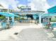 A vibrant outdoor bar and grill features a lively atmosphere with ample seating and a tropical vibe at 3062 Pirate Way, Kissimmee, FL 34747
