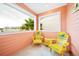 Balcony features Adirondack chairs, a small table and a beautiful view of the surrounding area at 3062 Pirate Way, Kissimmee, FL 34747