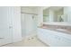 Bright bathroom features a double vanity with granite countertops and a walk-in shower at 3479 Courtland Blvd, Deltona, FL 32738