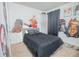 Bedroom with artistic wall art and black bedding at 3479 Courtland Blvd, Deltona, FL 32738