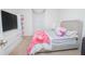 Bedroom with large bed and window featuring decor at 3479 Courtland Blvd, Deltona, FL 32738