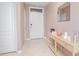 Hallway with console table, mirror, and white door at 3479 Courtland Blvd, Deltona, FL 32738