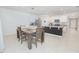 Open kitchen and dining area with stainless steel appliances, island and ample cabinet space at 3479 Courtland Blvd, Deltona, FL 32738