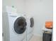 Bright Laundry room featuring a modern washer and dryer at 3479 Courtland Blvd, Deltona, FL 32738