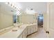 Bright bathroom with double sinks, ample storage, and a shower at 3987 Lancashire Ln # 3987, Longwood, FL 32779