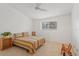 Cozy bedroom featuring a window, ceiling fan, and a full sized bed with a brightly striped bedspread at 3987 Lancashire Ln # 3987, Longwood, FL 32779